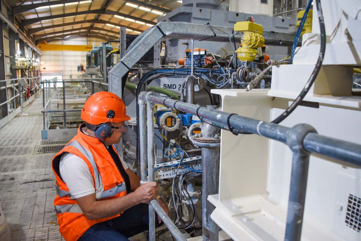 FiberLean engineer working on MFC plant equipment