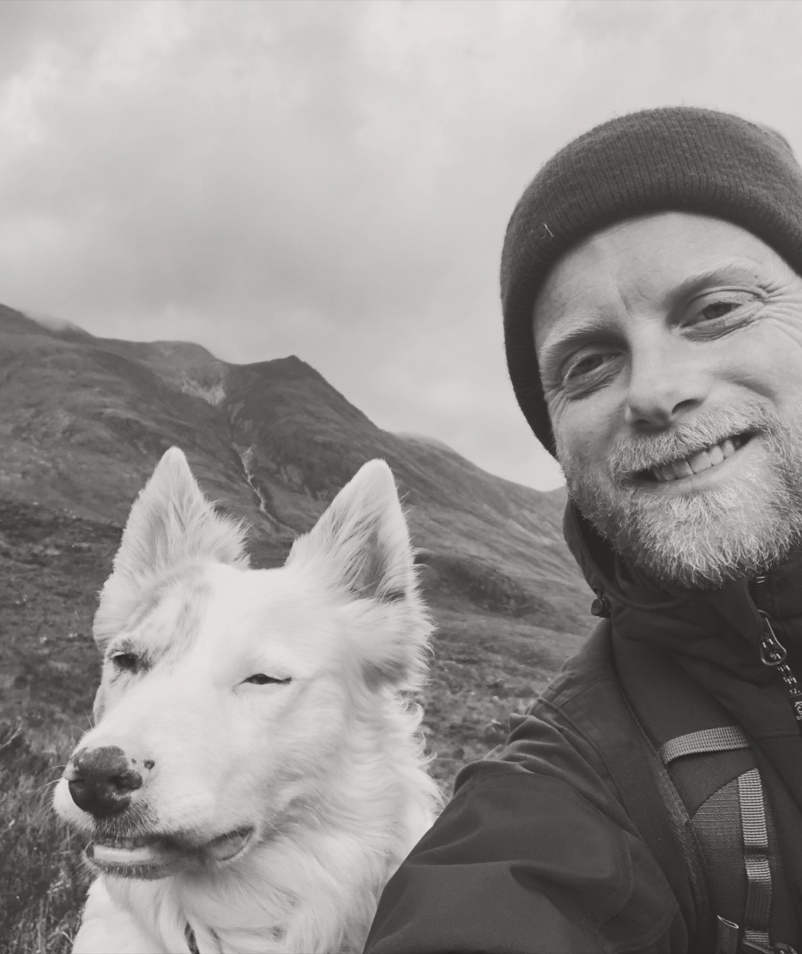 Kardeva Restoration owner and his merle dog